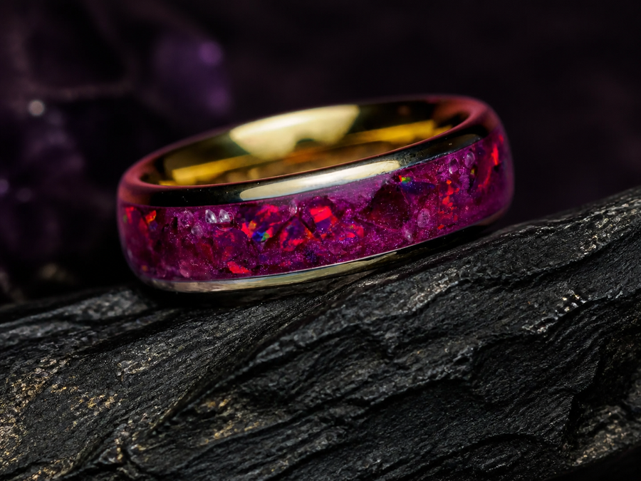 Imperial Nocturne garnet and royal purple opal ring on dark volcanic stone