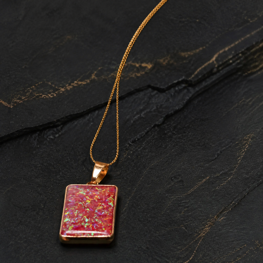 Solar Ember Prism purple Bello opal pendant on dark geological slate