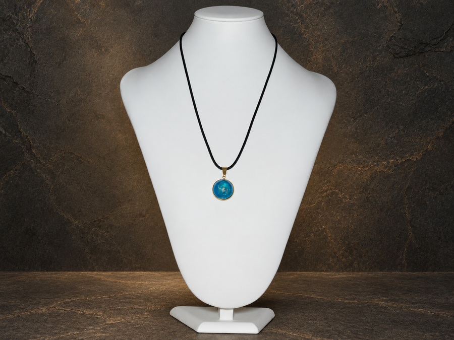 Azure Relic blue disc pendant displayed on a necklace bust
