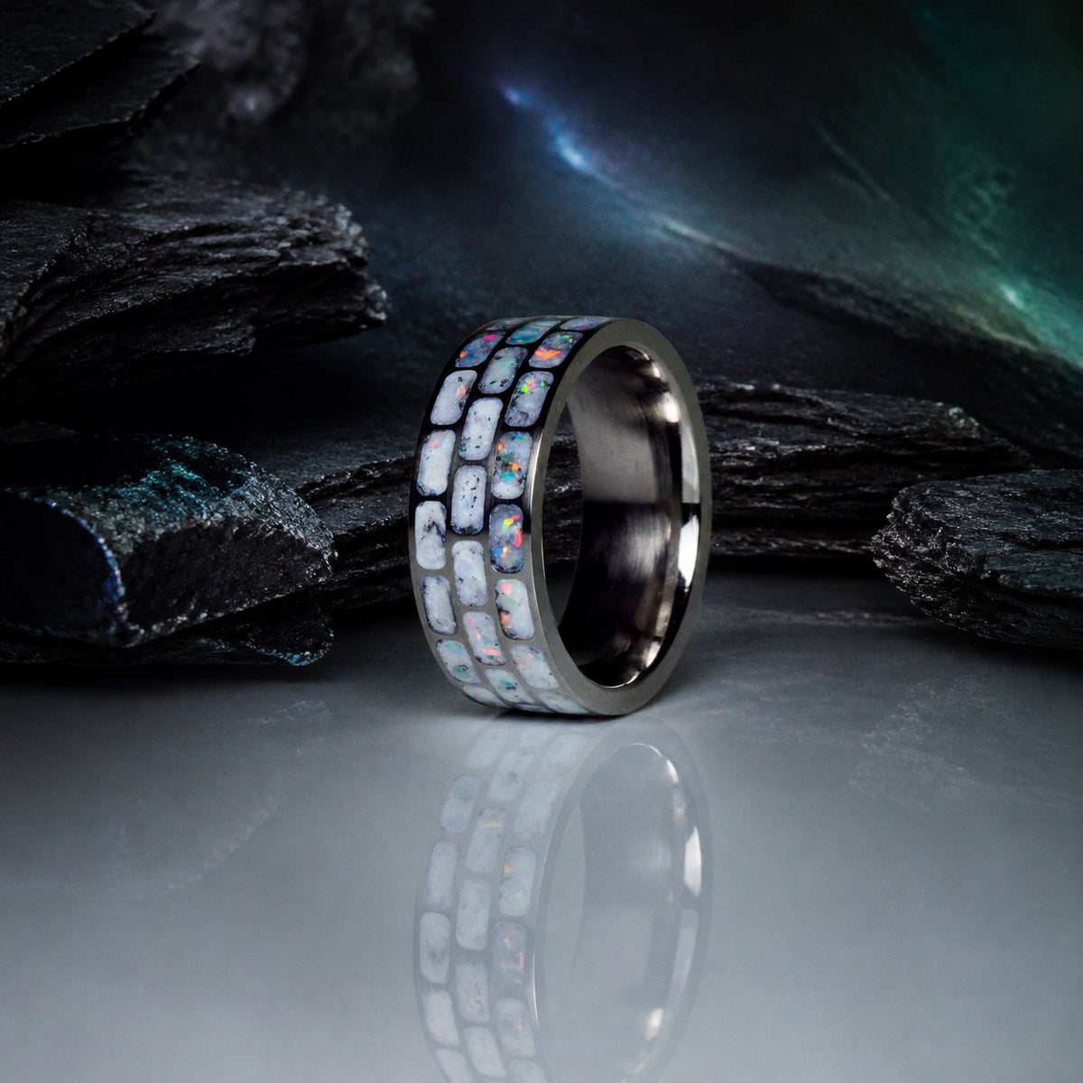 Titanium Opal Glow Ring in a dark mineral atelier setting