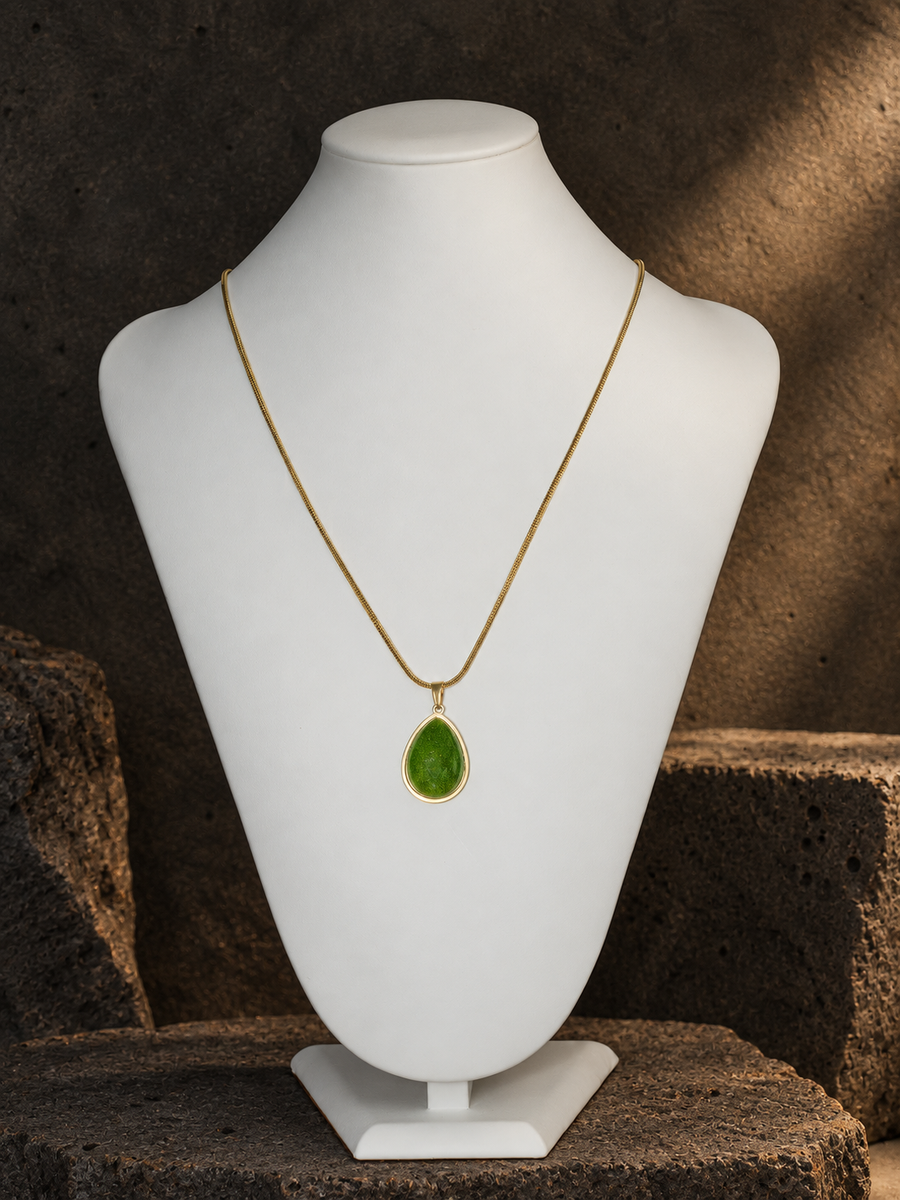 Verdant Archive green teardrop pendant on gold-toned chain