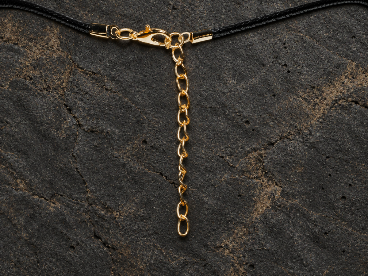 Azure Relic disc pendant with gold-toned chain extension detail