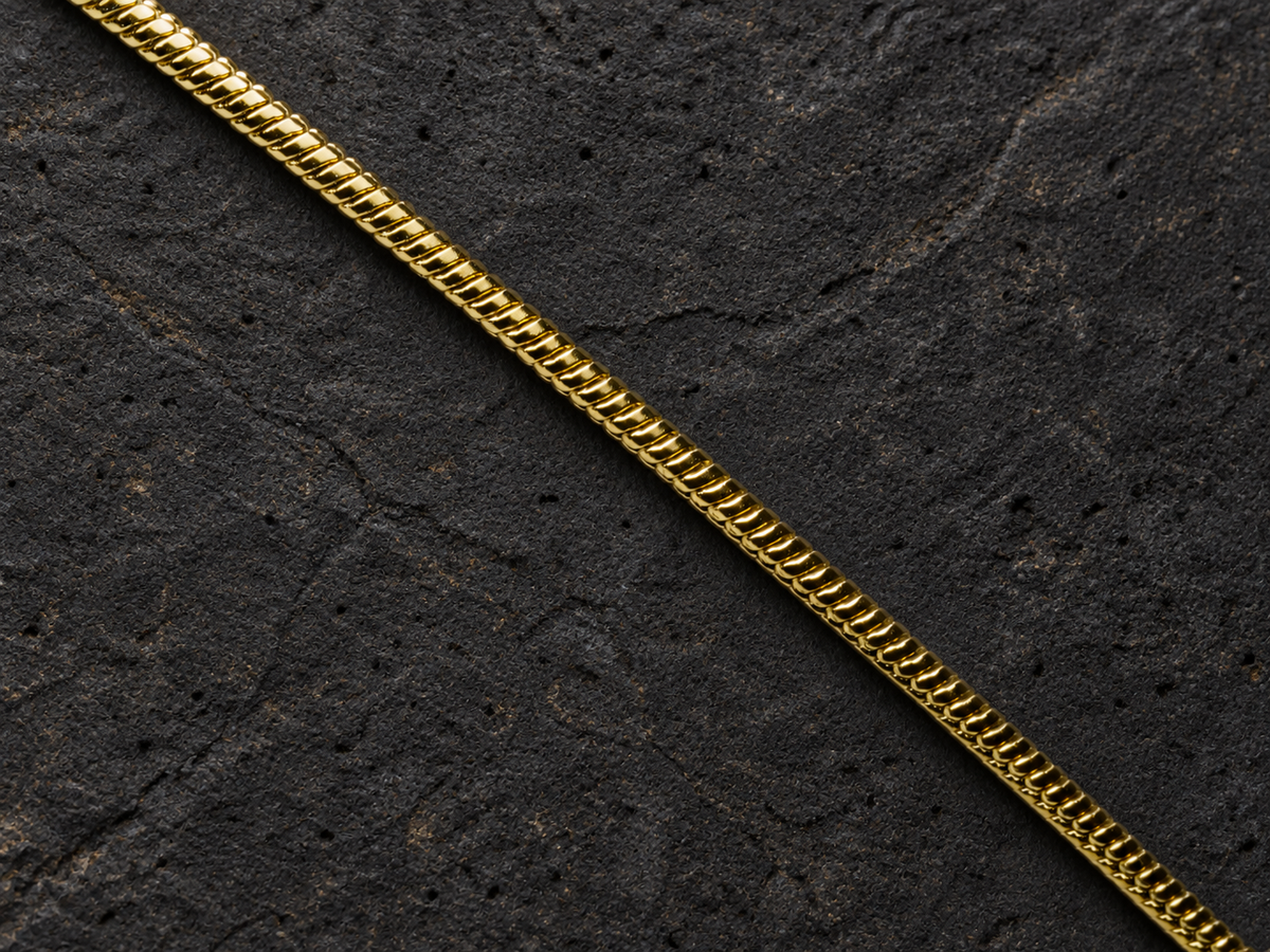 Rose Strata disc pendant with matching gold-toned chain detail