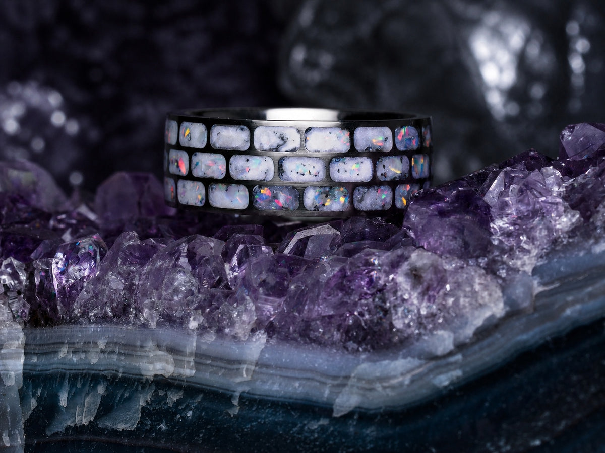Titanium Opal Glow Ring above an amethyst crystal formation