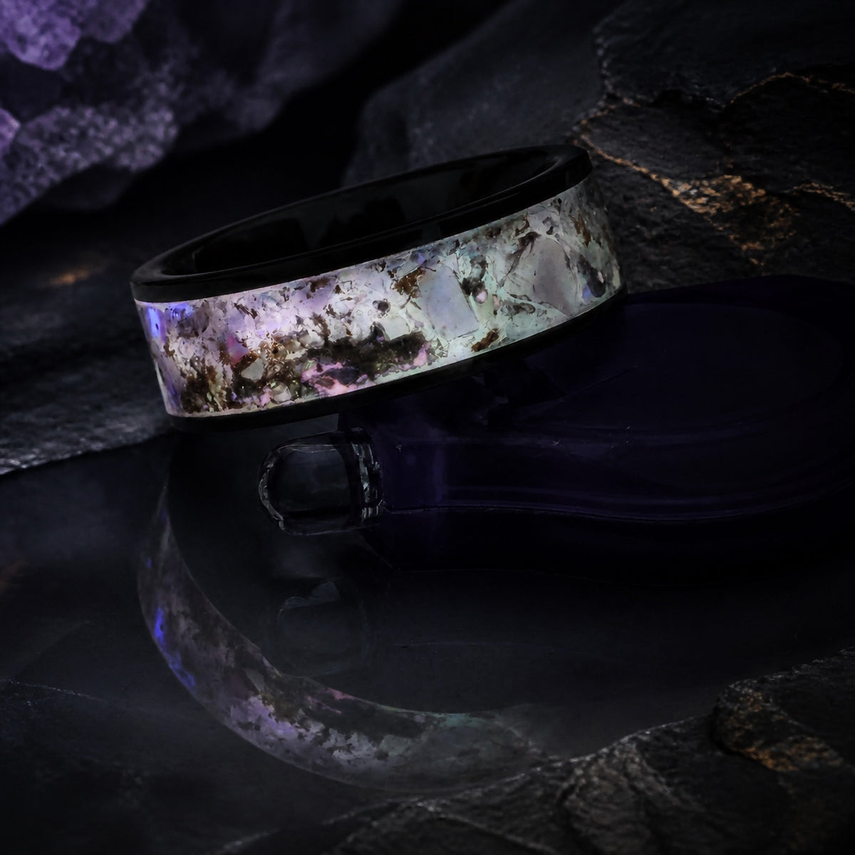 Close detail of the Star-Dust Amethyst ring with reflected mineral light
