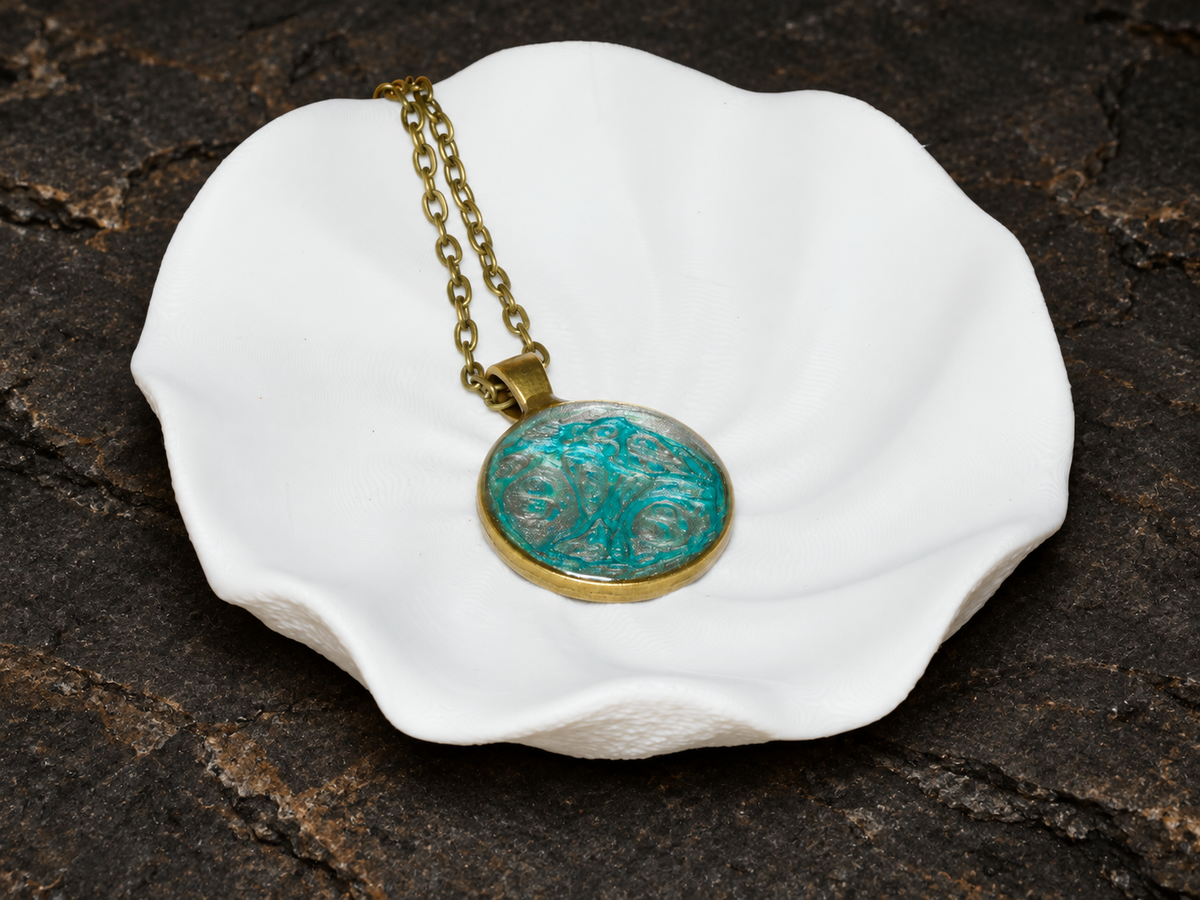 Tidal Archive round pendant on a sculptural display