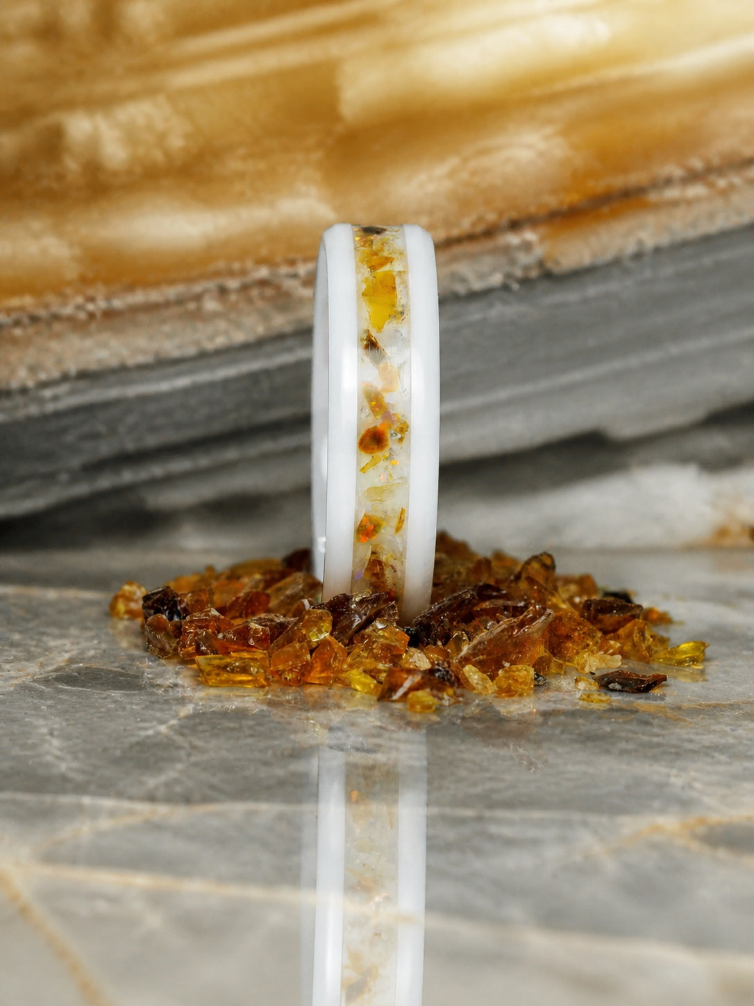 Front view of the Resin of Time: Afterglow ring with amber and opal inlay