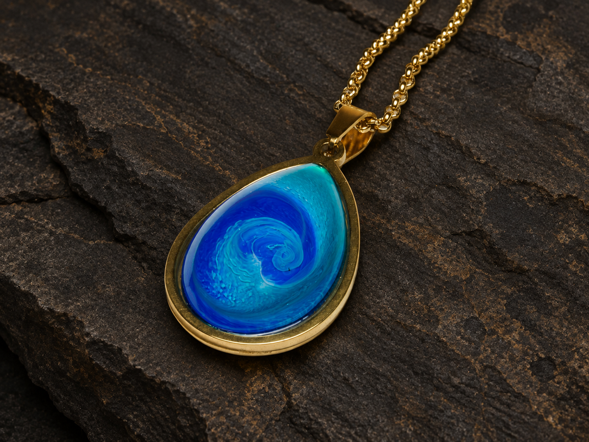 Abyssal Current blue teardrop pendant angled close-up