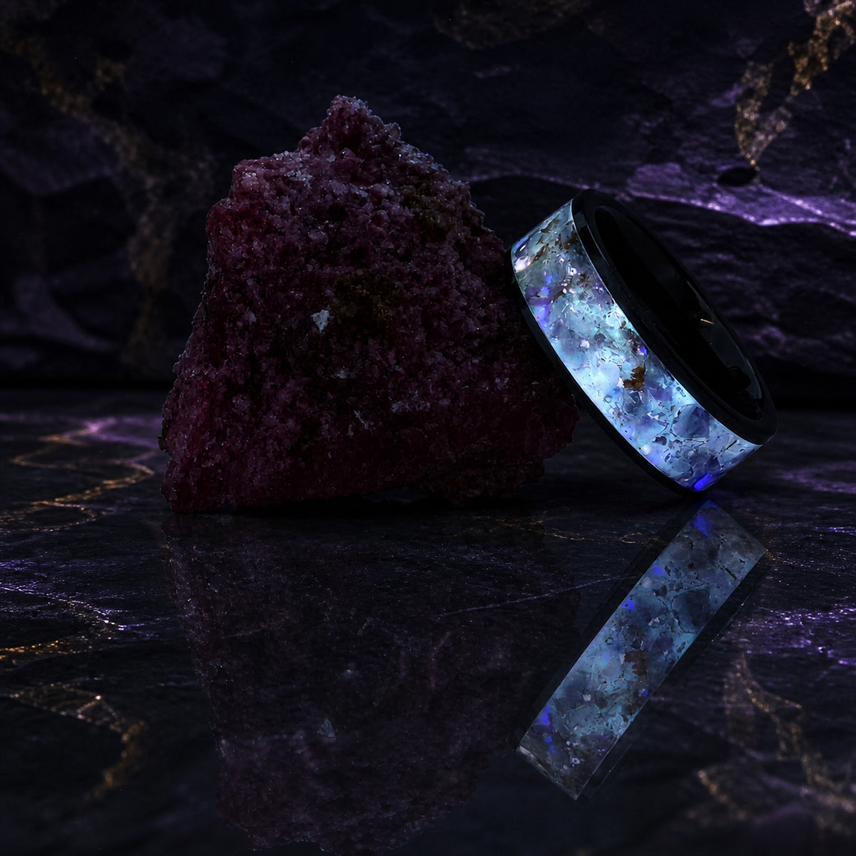 Star-Dust Amethyst ring glowing beside a purple mineral specimen