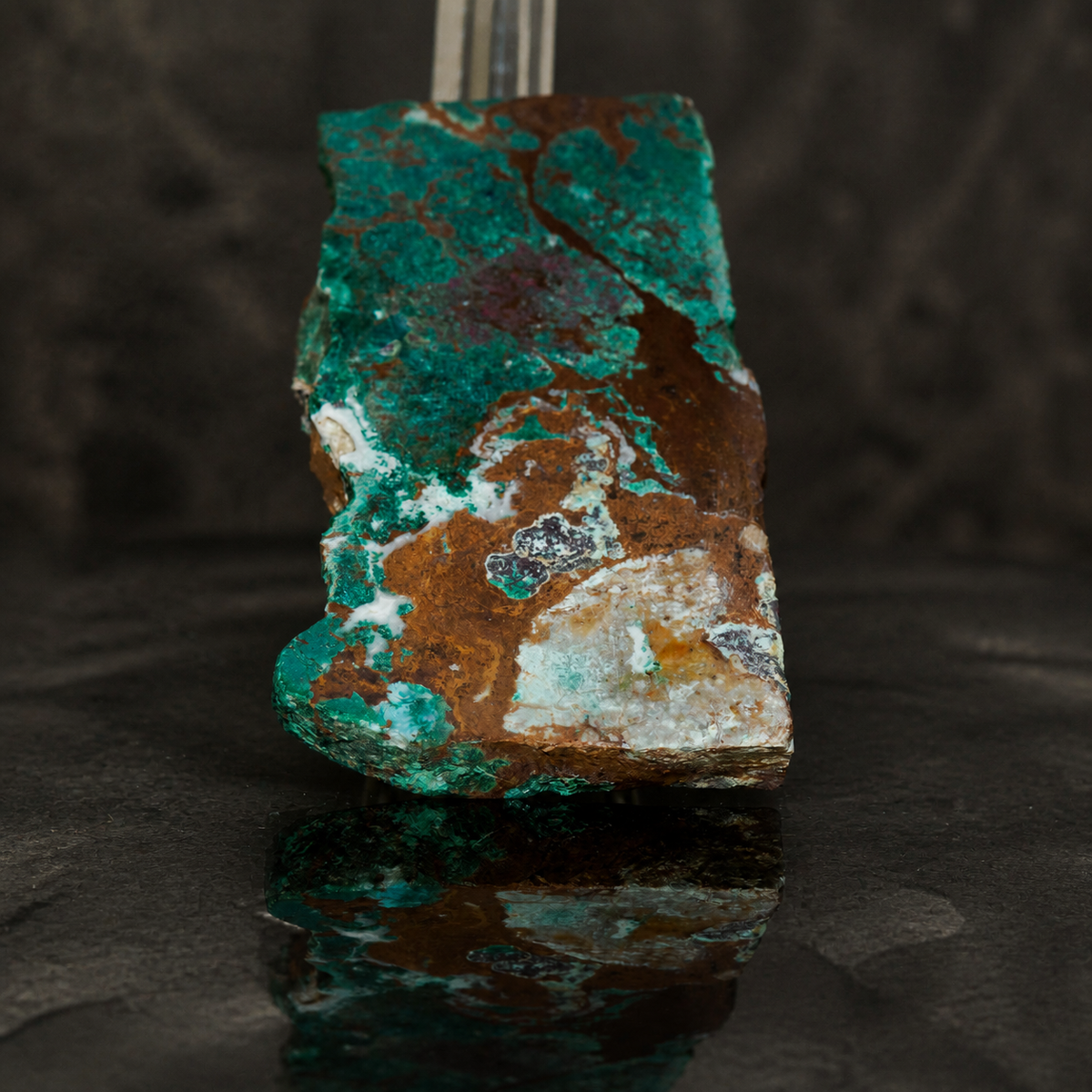 DeGrussa malachite with cuprite specimen on clear acrylic stand, close view