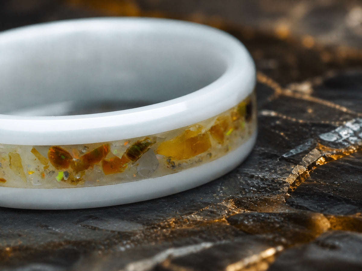 Macro detail of genuine amber and opal fragments inside the Resin of Time ring