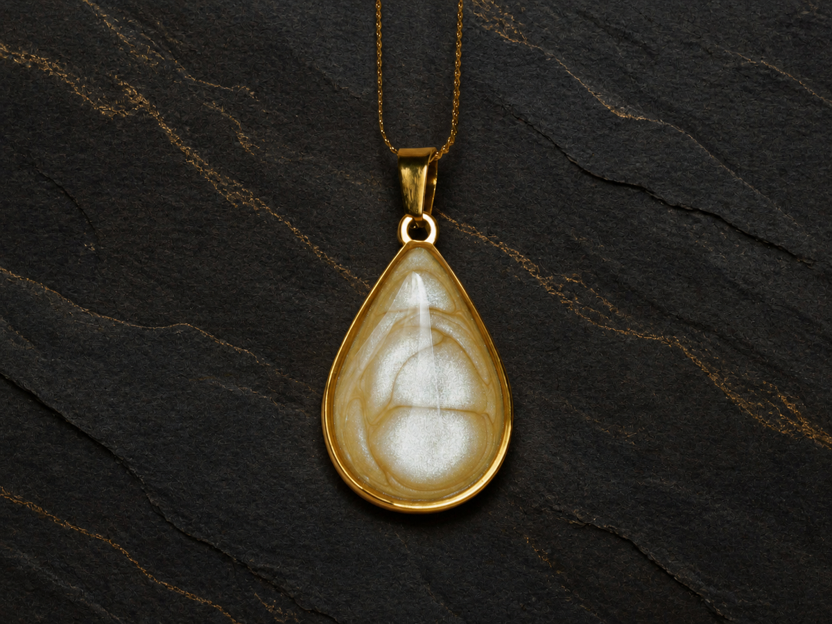Ivory Strata pearlescent enamel teardrop pendant close-up
