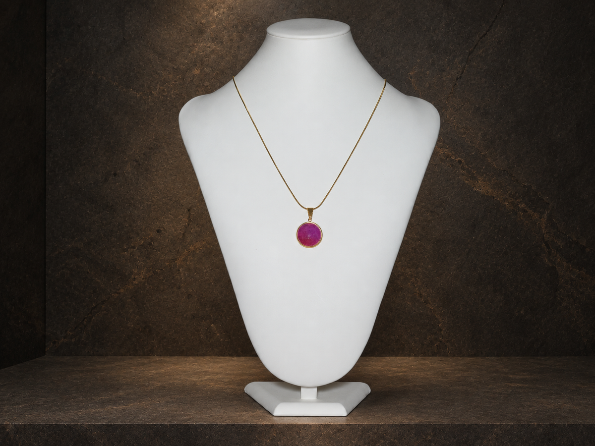 Rose Strata disc pendant displayed on a necklace bust