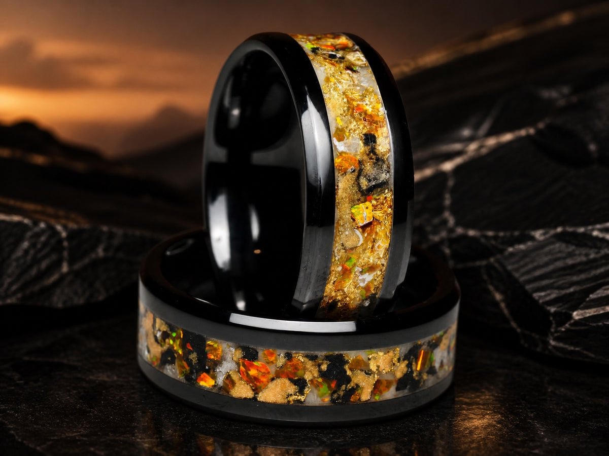 Two Gilded Eventide rings arranged on a display base