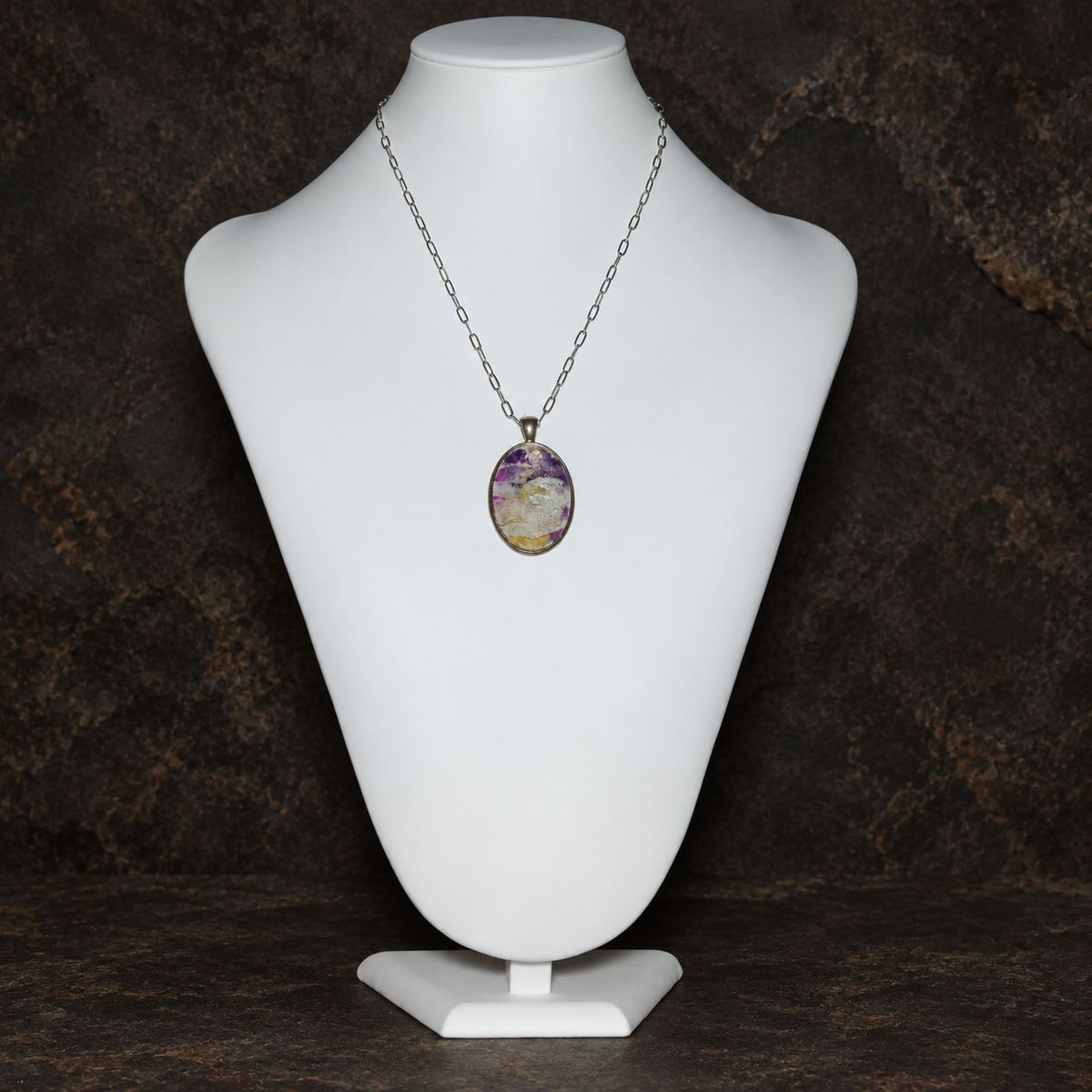 Violet Strata pendant necklace shown at full length on a display bust