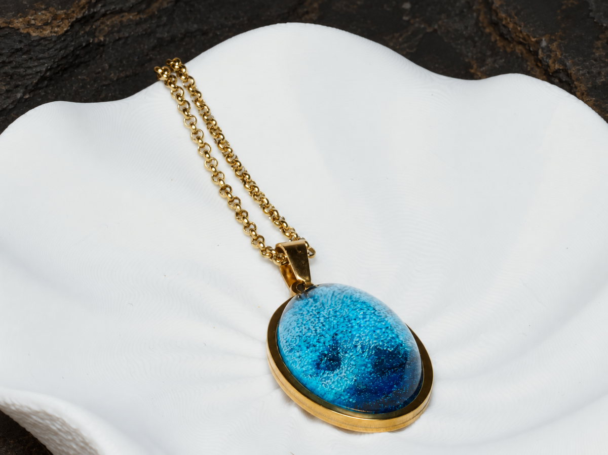 Abyssal Horizon blue oval pendant close-up on sculptural display