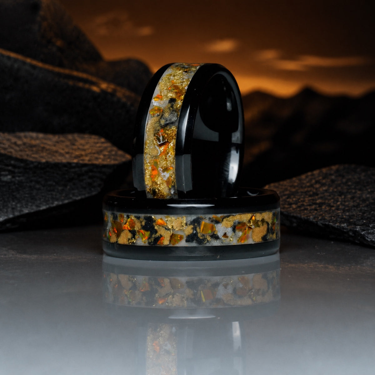 Gilded Eventide ring pair with warm mineral reflection