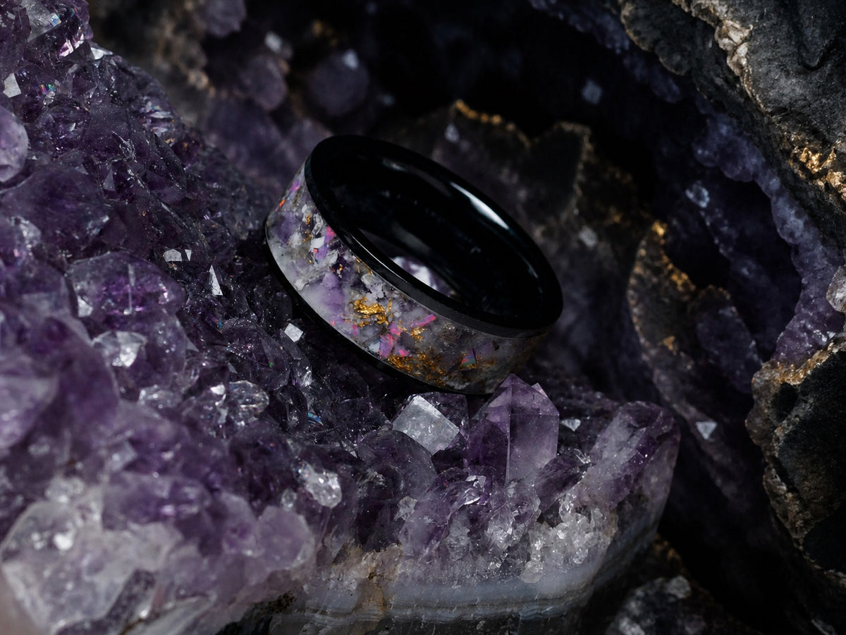 Star-Dust Amethyst ring resting on a natural amethyst crystal cluster