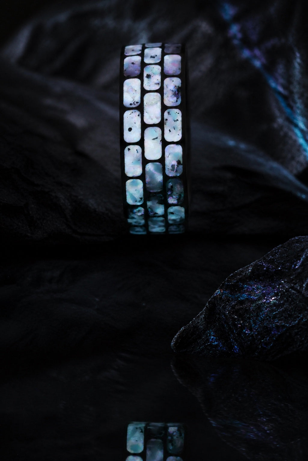 Vertical long-exposure glow view of the Titanium Opal Glow Ring