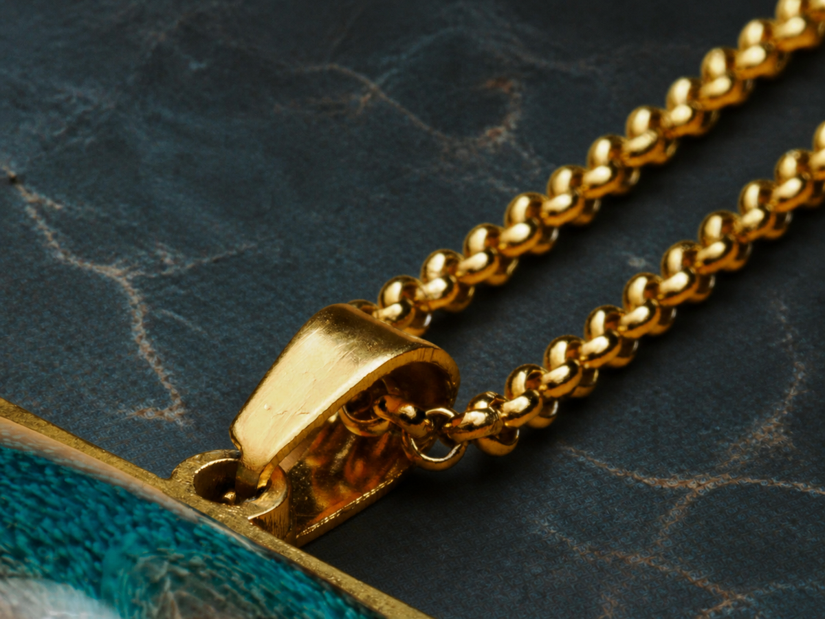 Detail of the Tidal Fault pendant bail and gold-plated chain