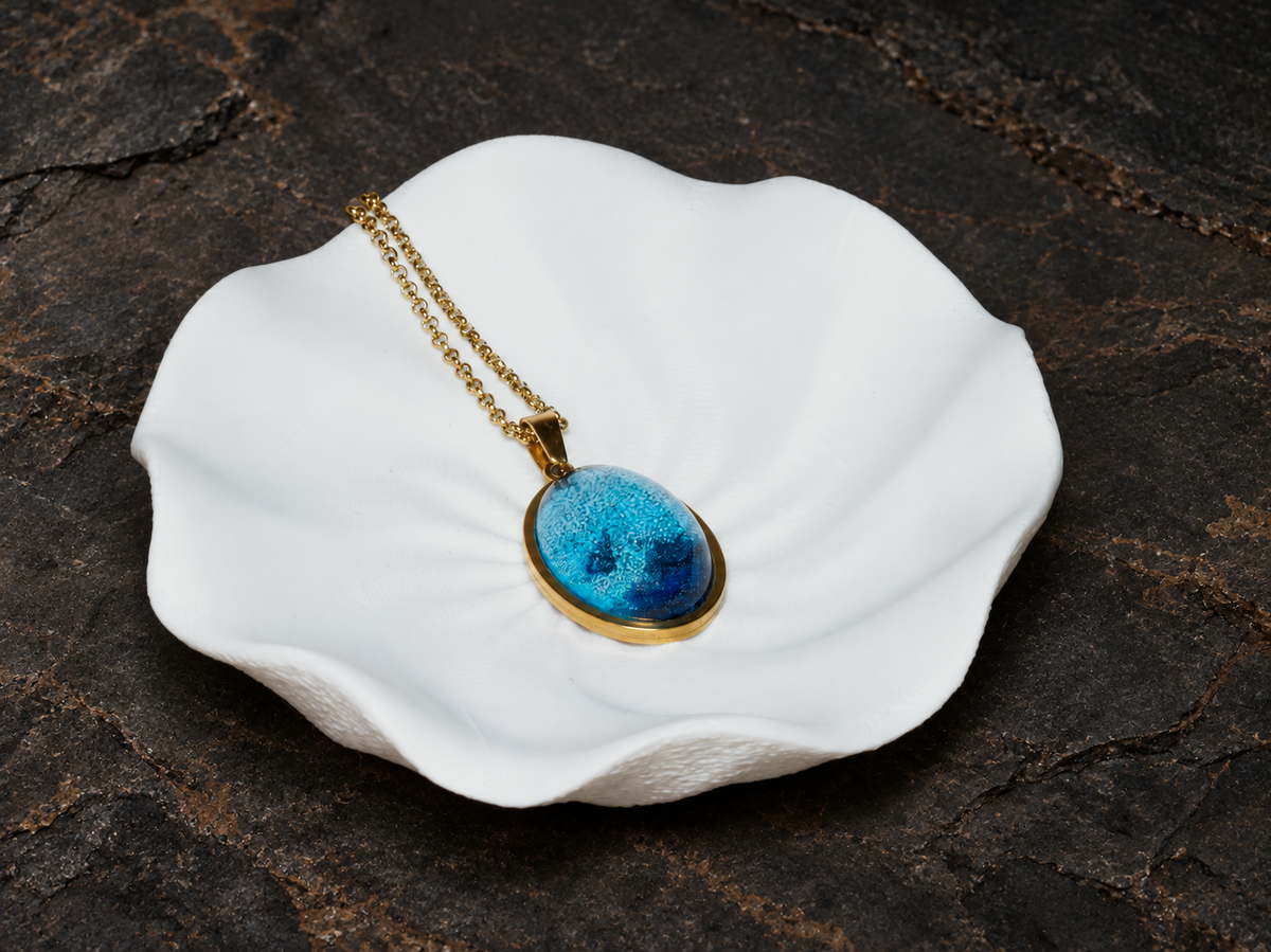 Abyssal Horizon oval pendant on a sculptural display