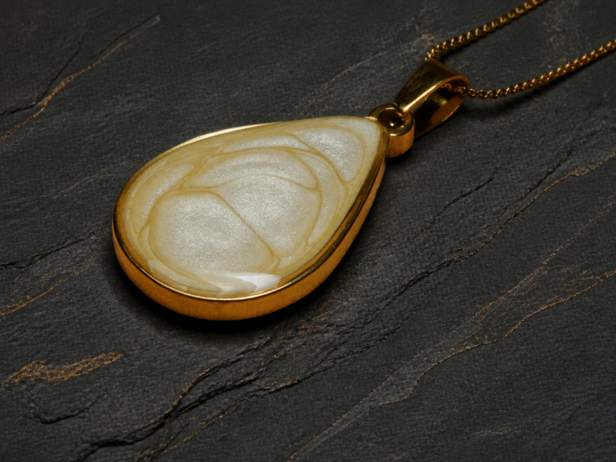Ivory Strata teardrop pendant flat-lay angle