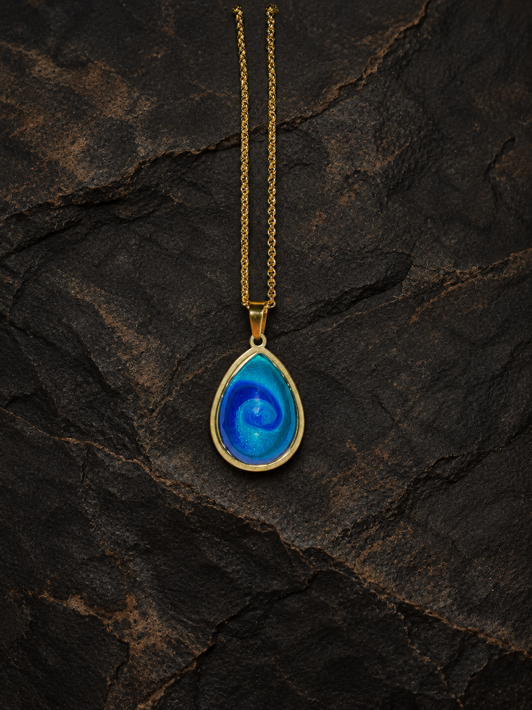 Abyssal Current teardrop pendant and gold box chain portrait view