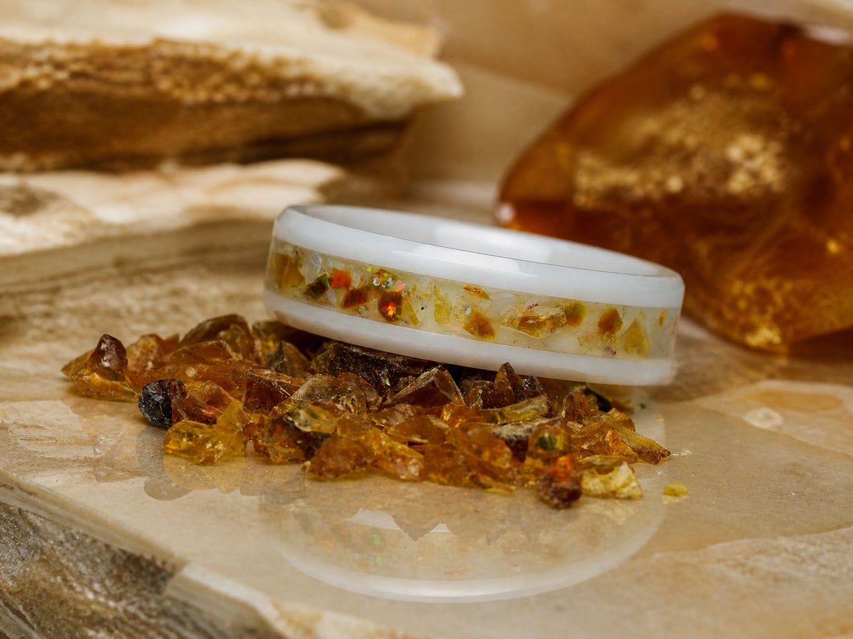 Low-angle view of the Resin of Time: Afterglow ring among warm amber fragments