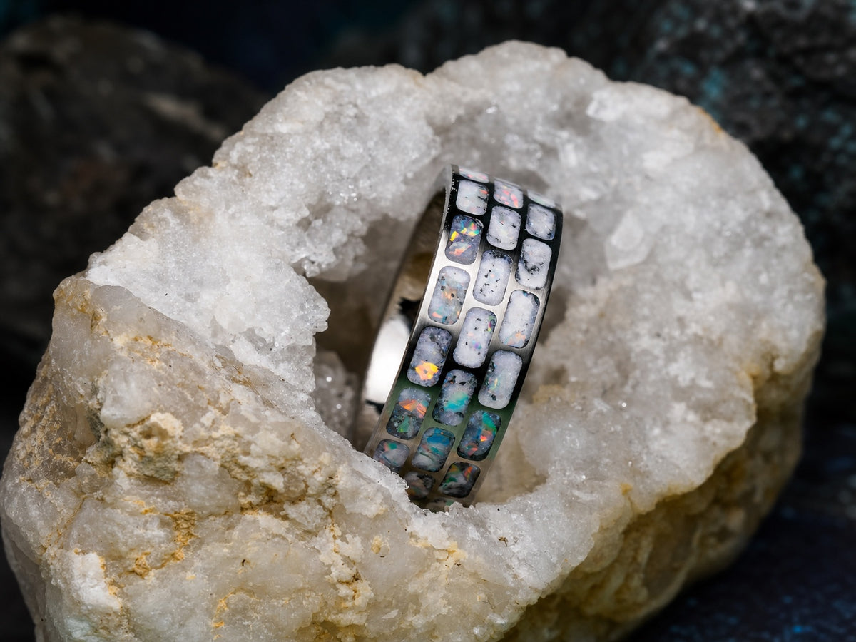 Titanium Opal Glow Ring nestled in a white crystalline geode