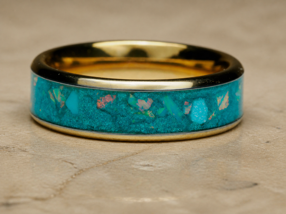 Tidal Archive Ring horizontal close-up showing blue-green turquoise and opal inlay with gold-plated interior