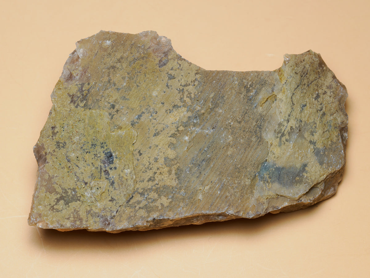 Reverse of the botryoidal chalcedony specimen showing its earthy natural matrix