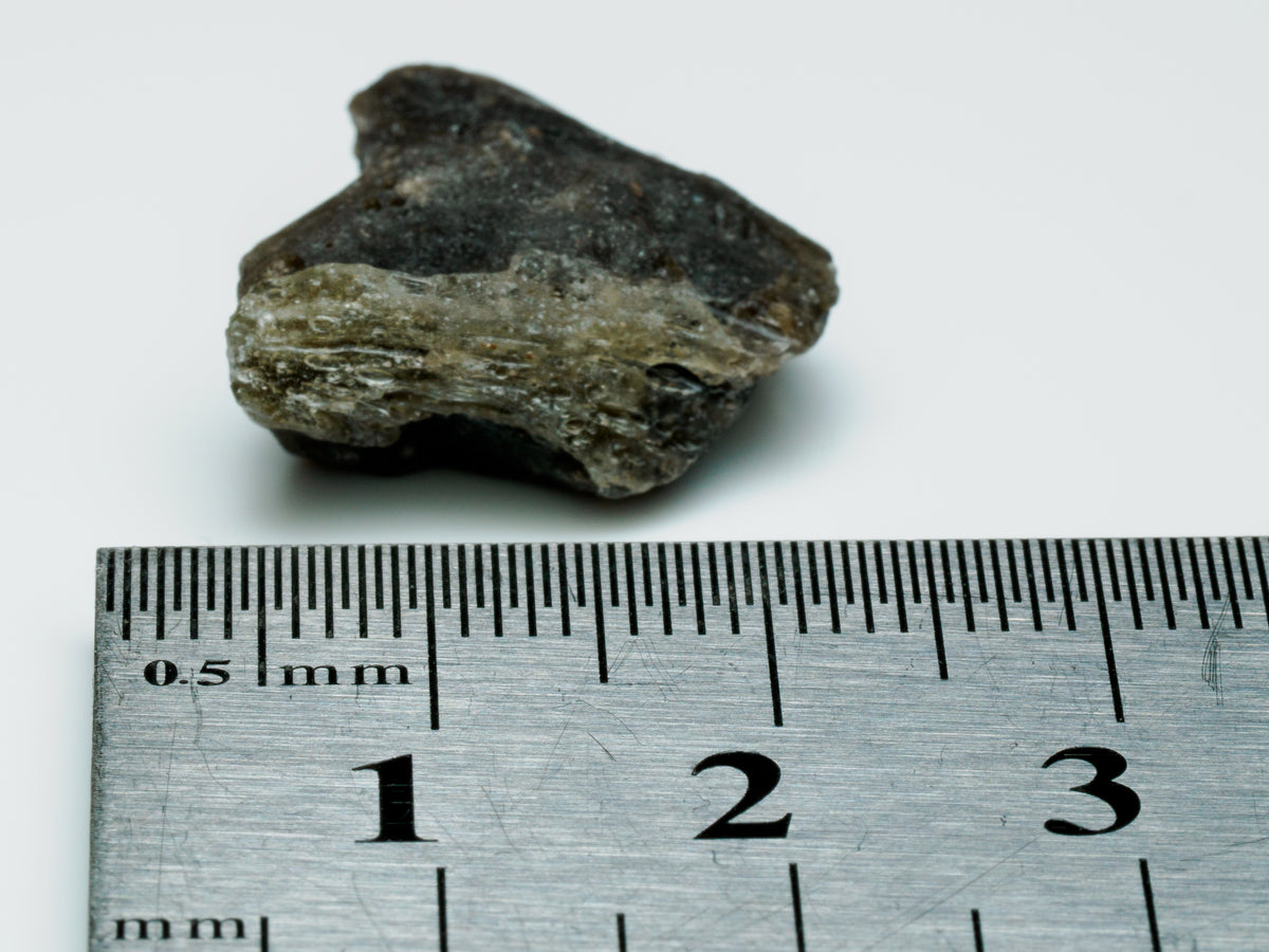 Darwin Glass — Tasmania Impact Glass Fragment (2 g), impact-glass specimen, angled view.