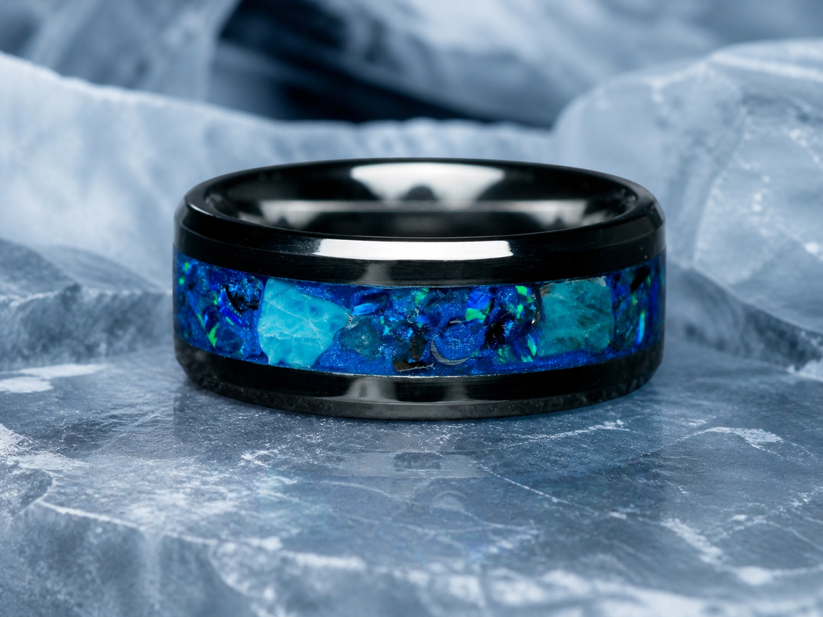 Abyssal Impact front view of blue apatite and meteorite inlay ring on ice