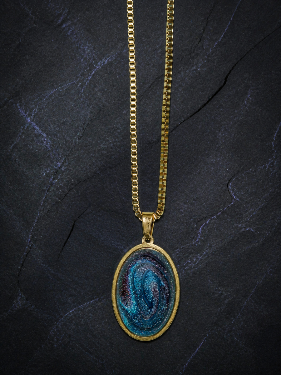 Abyssal Spiral oval pendant with blue-violet resin dome on a large gold box chain