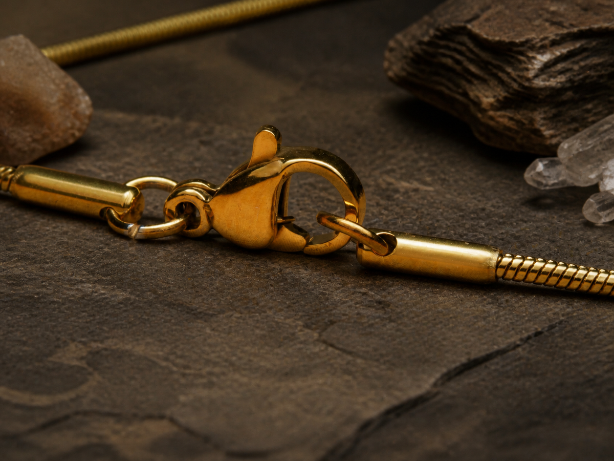 Detail of the Ancient Light Pendant chain clasp on a mineral background