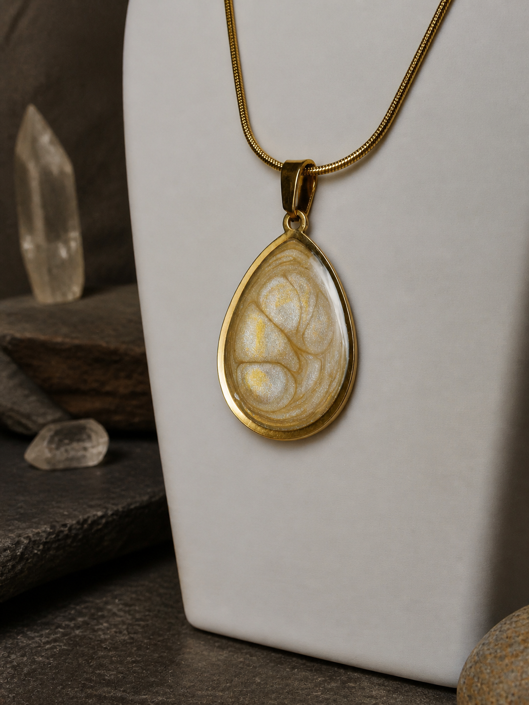 Close view of the Ancient Light Pendant on a jewellery bust with crystal accents