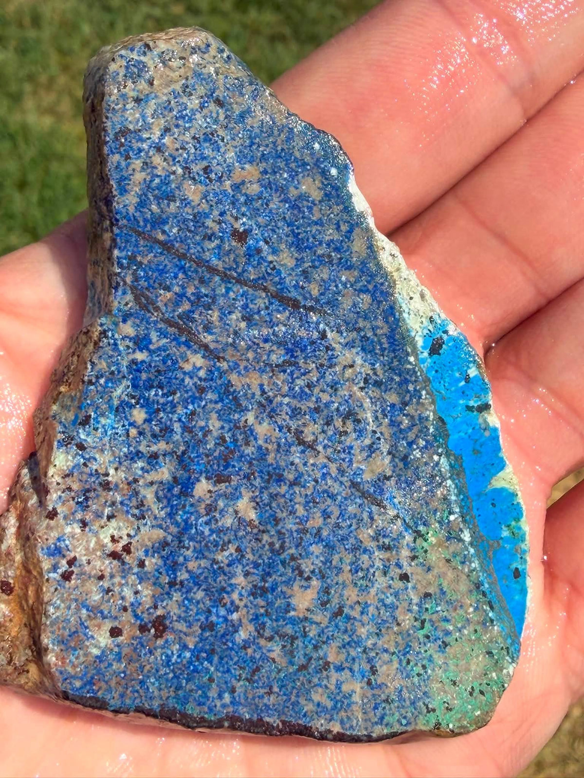 Supplier photograph of the azurite slab shown wet outdoors