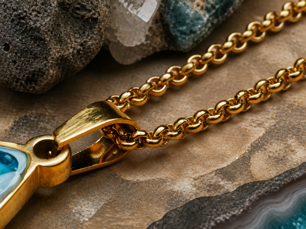 18K gold chain and pendant bale with pale blue Bello opal, macro mineral-styled view