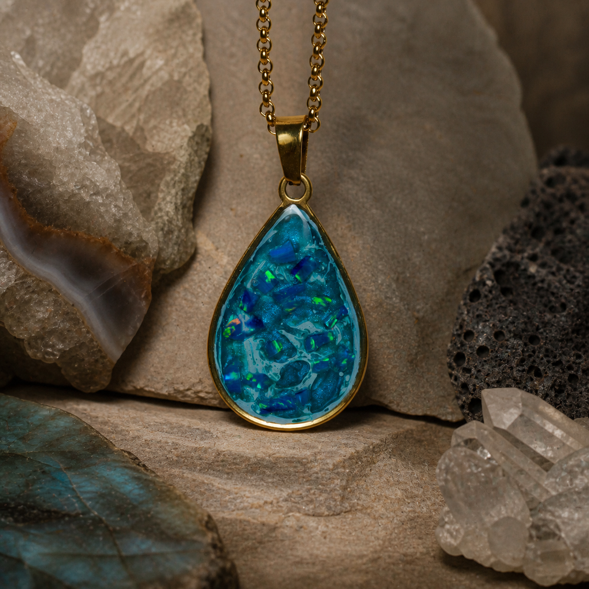 18K gold pendant with pale blue Bello opal and blue flash, centered mineral-styled view