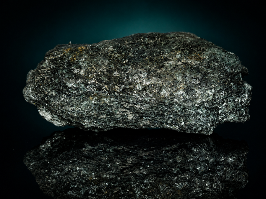 Dark fuchsite mica schist display specimen, layered side view