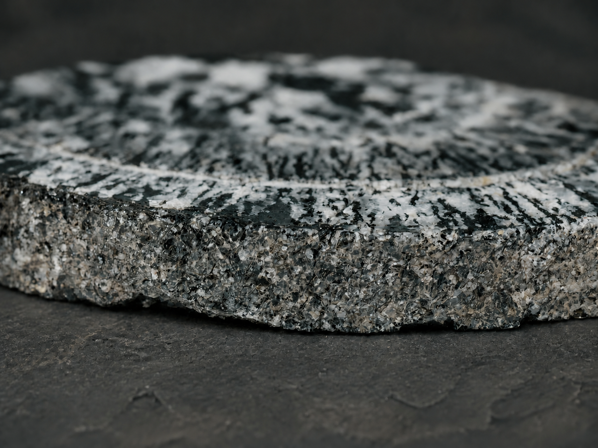 Boogardie orbicular granite specimen, close-up of rough edge and polished face