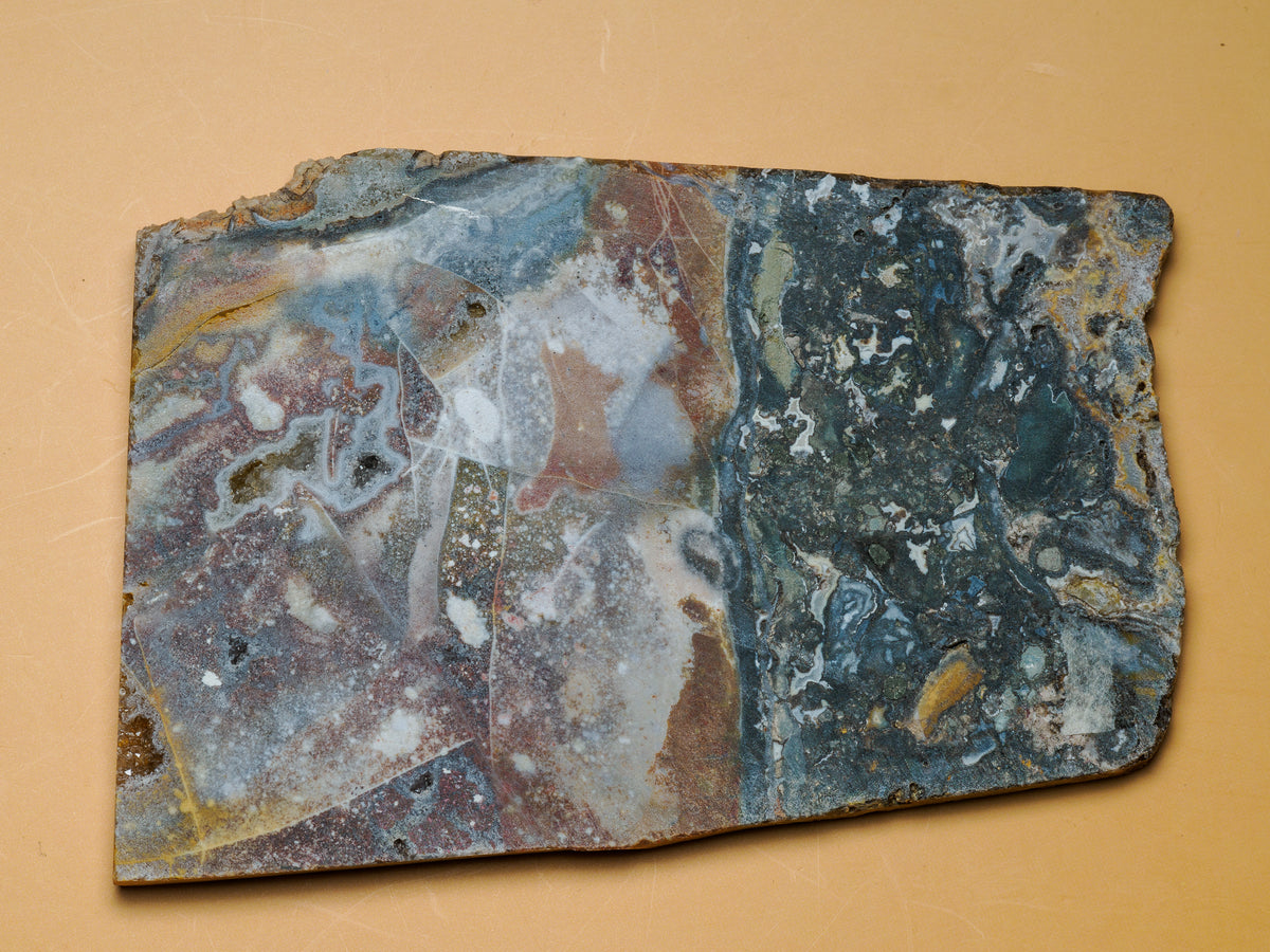 Brecciated jasper with agate slab, alternate face showing cream, rust and blue-grey sections.