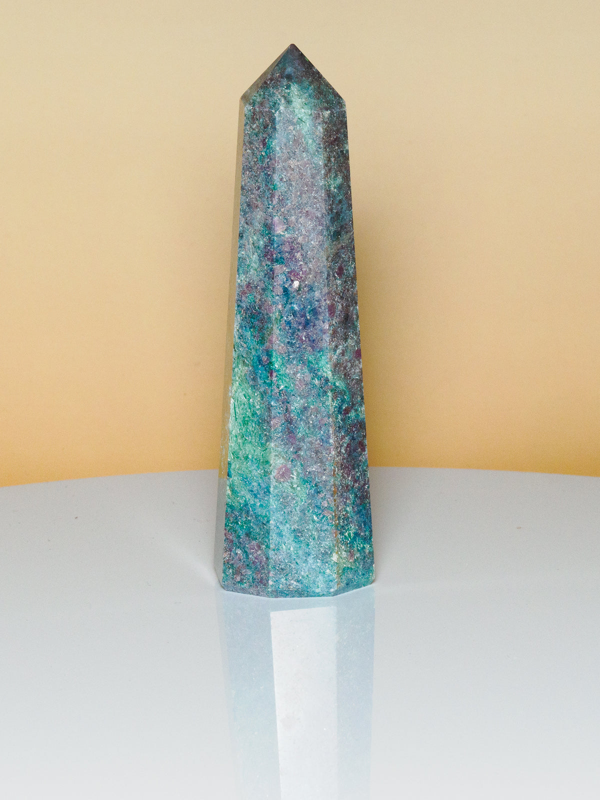 Unedited photograph of ruby in kyanite obelisk A in natural light, 10.5 cm tall