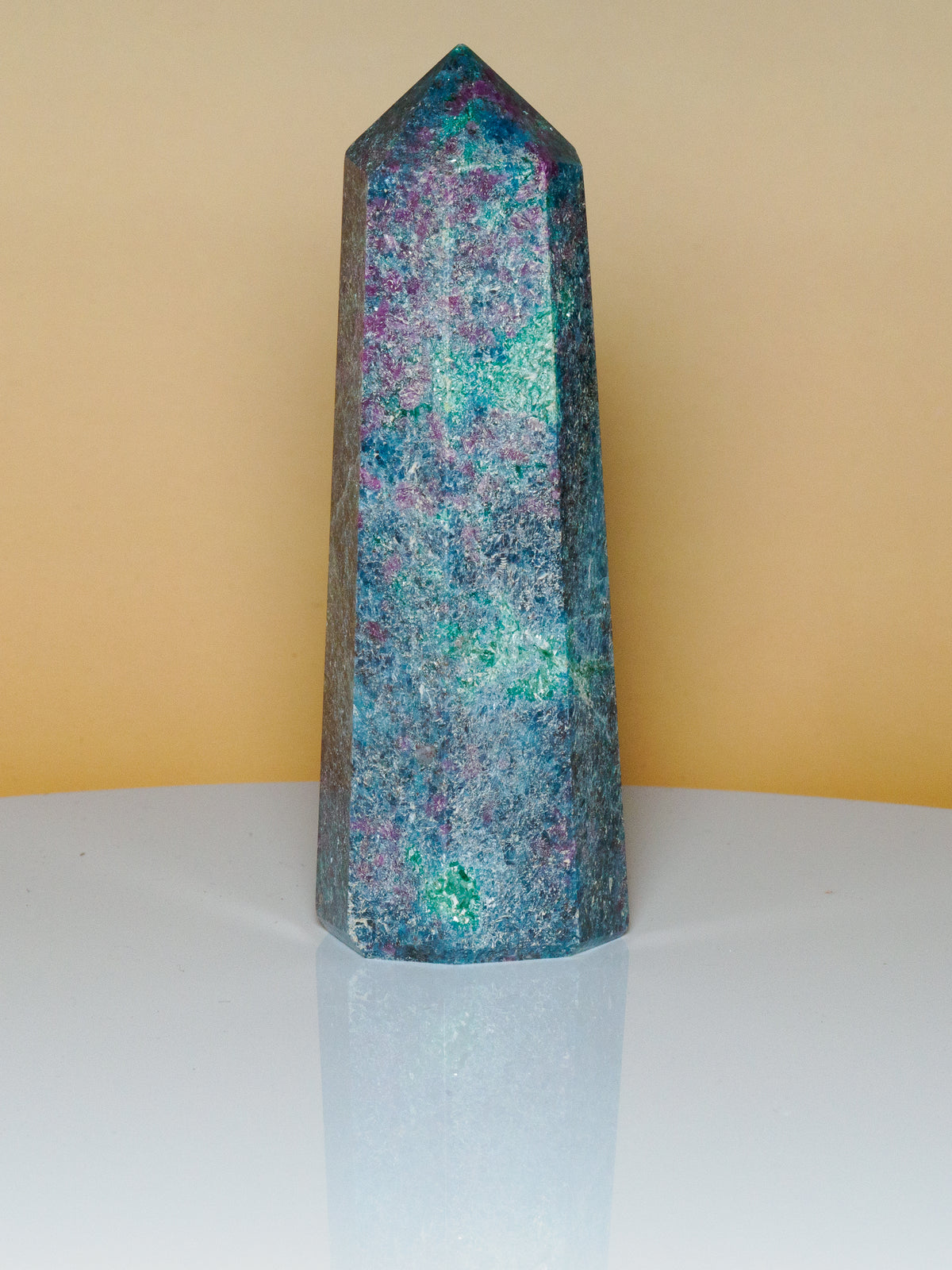 Unedited photograph of ruby in kyanite obelisk B in natural light, 10 cm tall
