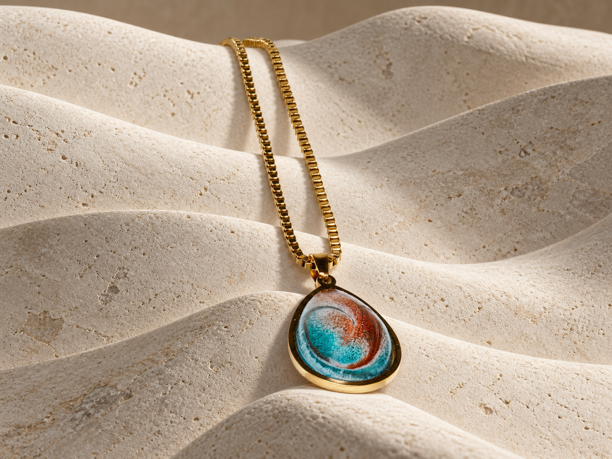Ember Tide teardrop pendant necklace on sculptural folded forms