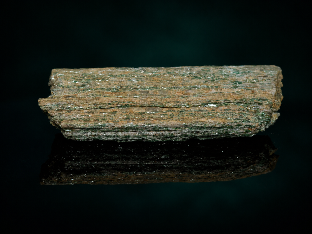 Green fuchsite mica schist display specimen, layered side view