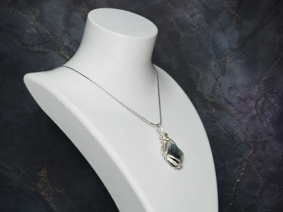 Riftlight natural flash labradorite wire-wrapped pendant necklace on display bust