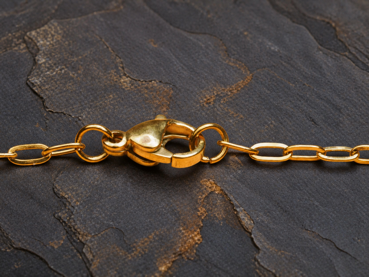 Close-up of the gold chain clasp and extension links for the Lavender Reef pendant
