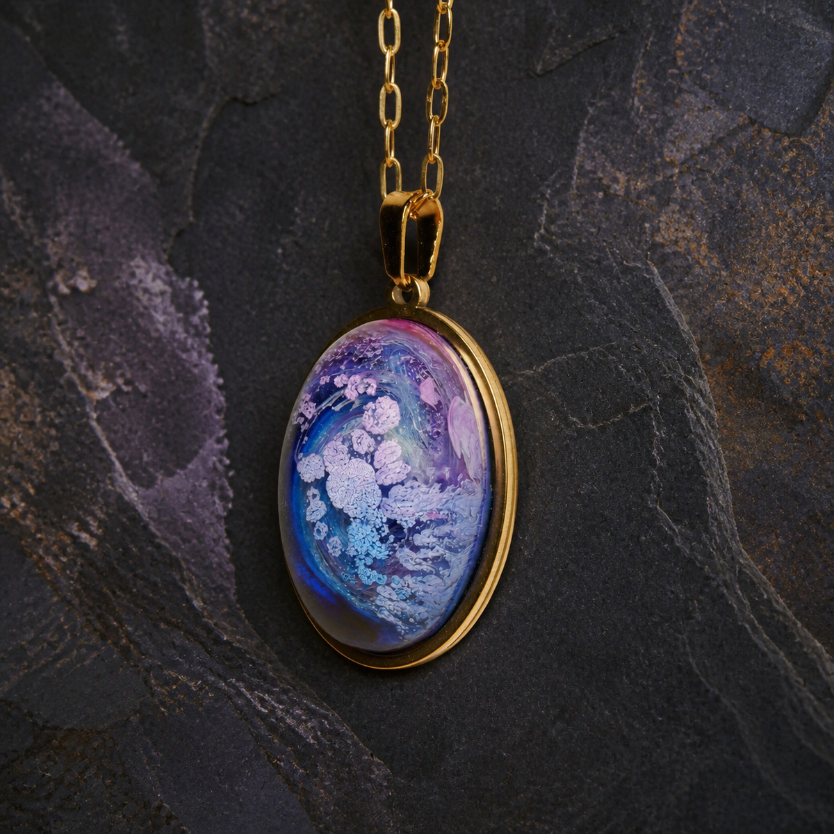 Detailed view of the Lavender Reef blue and lavender alcohol-ink resin oval pendant
