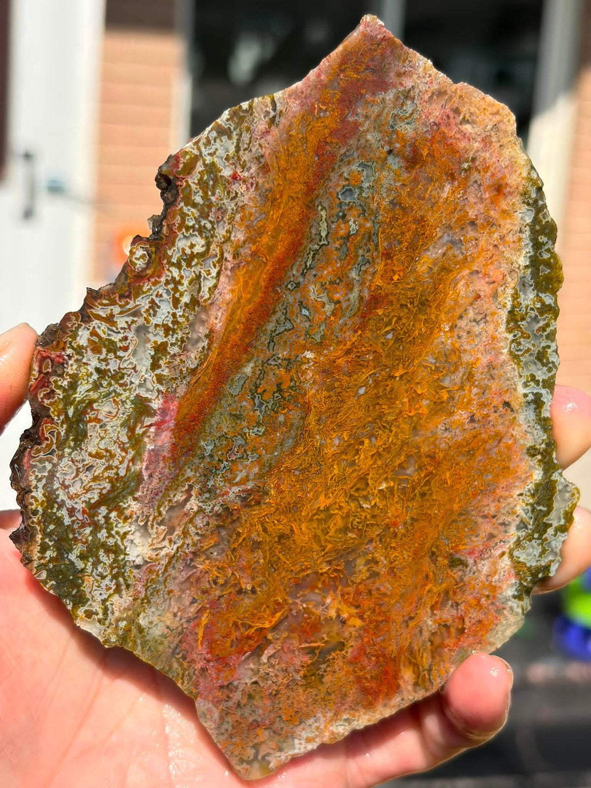 Supplier close-up photograph of the moss agate slab and its natural colour pattern
